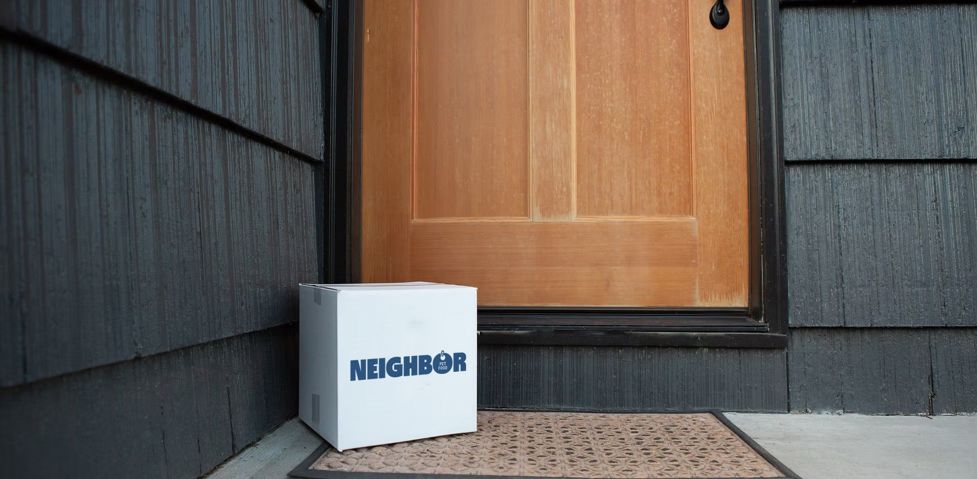 box of neighbor pet food in front of a residential door
