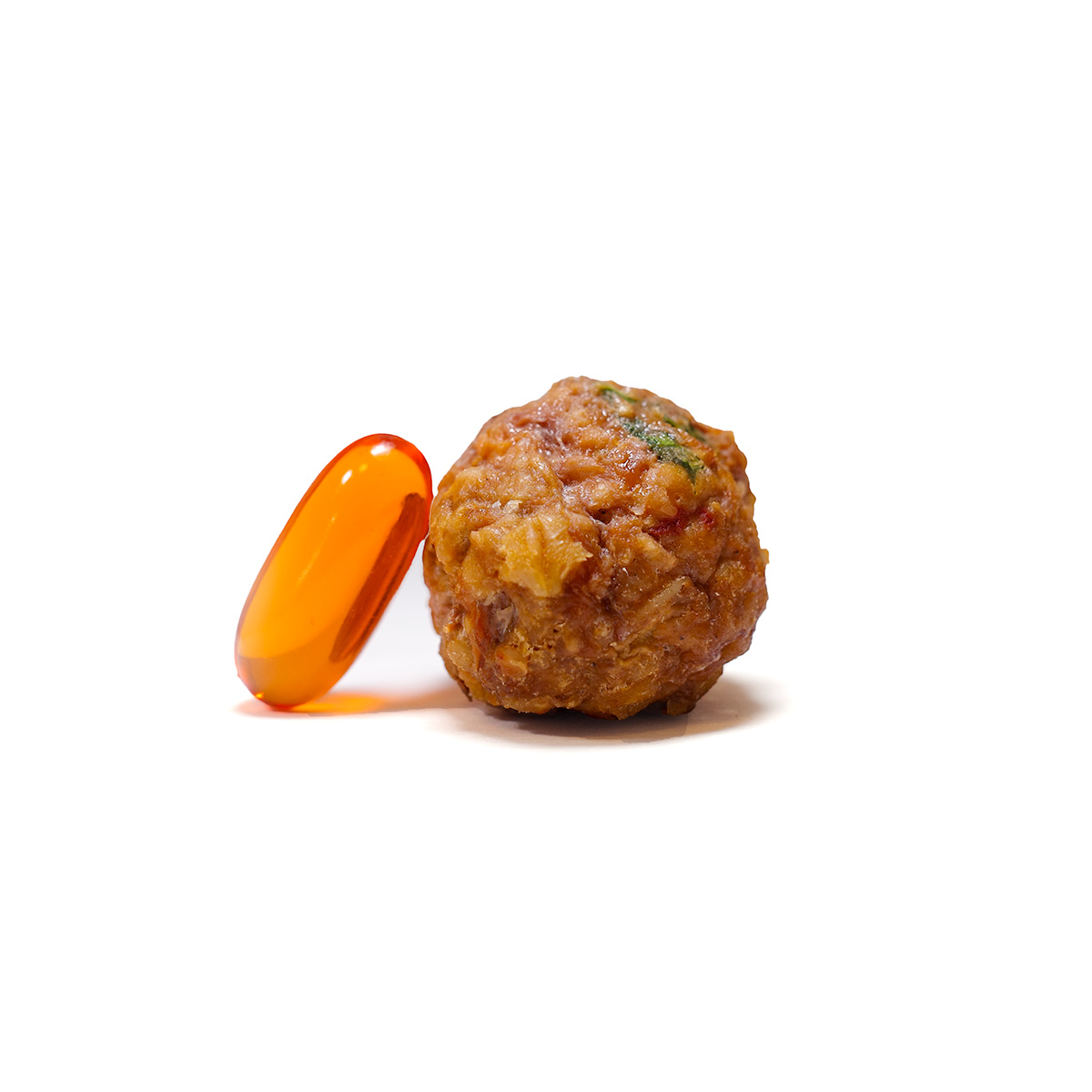 size of fresh neighbor pet food meatball next to a softgel