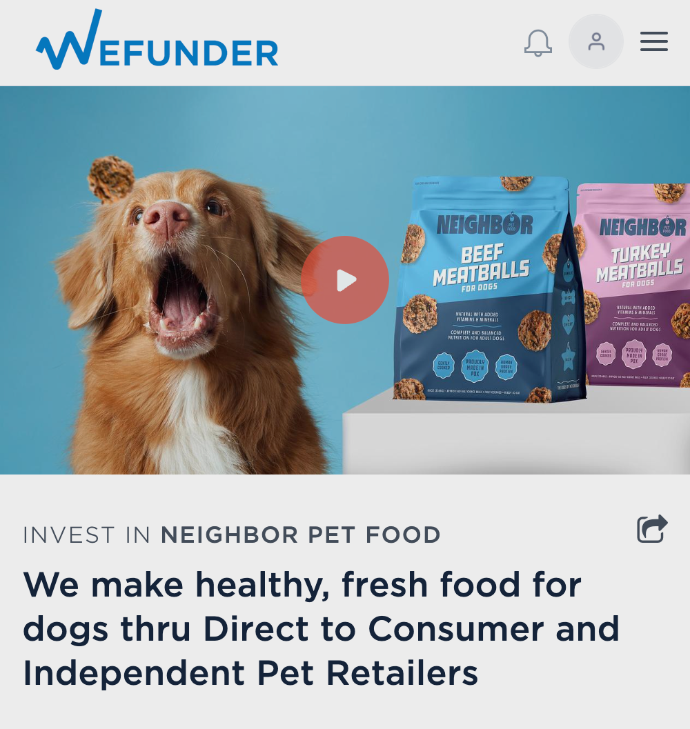 Dog opening its mouth about to catch a meatball.