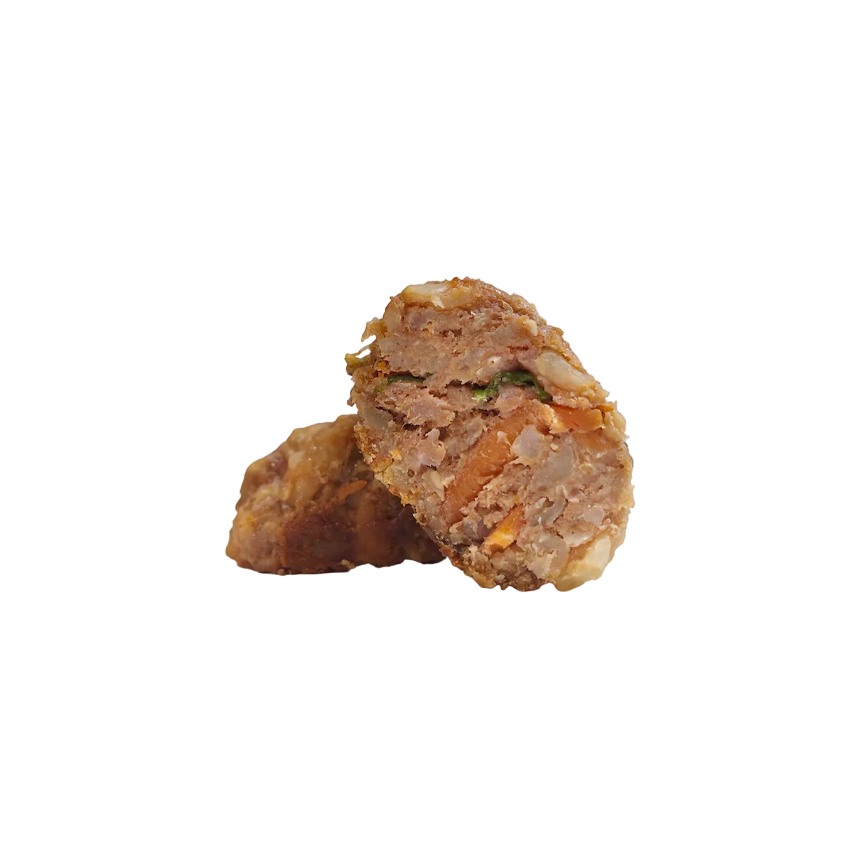 Closeup of a meatball with meat, veggies, and carrots for dogs
